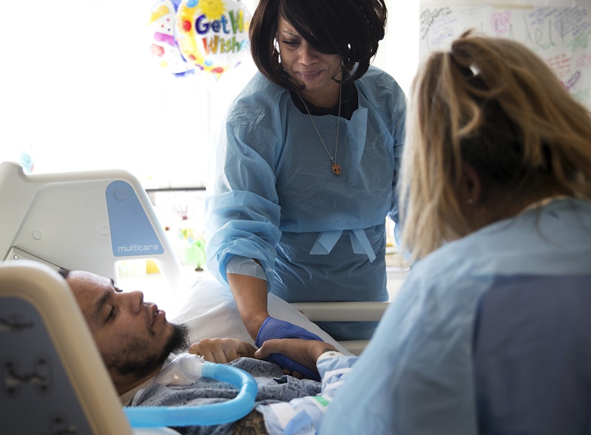 caption: LaDonna Horne becomes emotional after one of the first times that her son, DaShawn Horne, made a sound on Thursday, March 15, 2018, at Harborview Medical Center in Seattle. Three days later, DaShawn spoke words that could be understood.