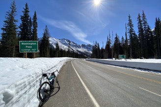 caption: A bike parked on the side of the North Cascades Highway near Washington Pass in 2024.