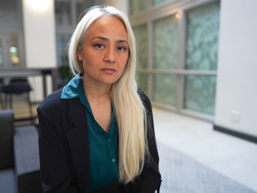 caption: Ngoc Phan spoke with press Monday, May 26th, 2025, about her husband's deportation to South Sudan at the offices of the Northwest Immigrant Rights Project in Seattle. She grew up in Tacoma.