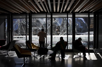 caption: Parents take photos of Amazon's biospheres from the Day 1 building during Amazon's bring your parents to work day on Friday, September 15, 2017, in Seattle. 