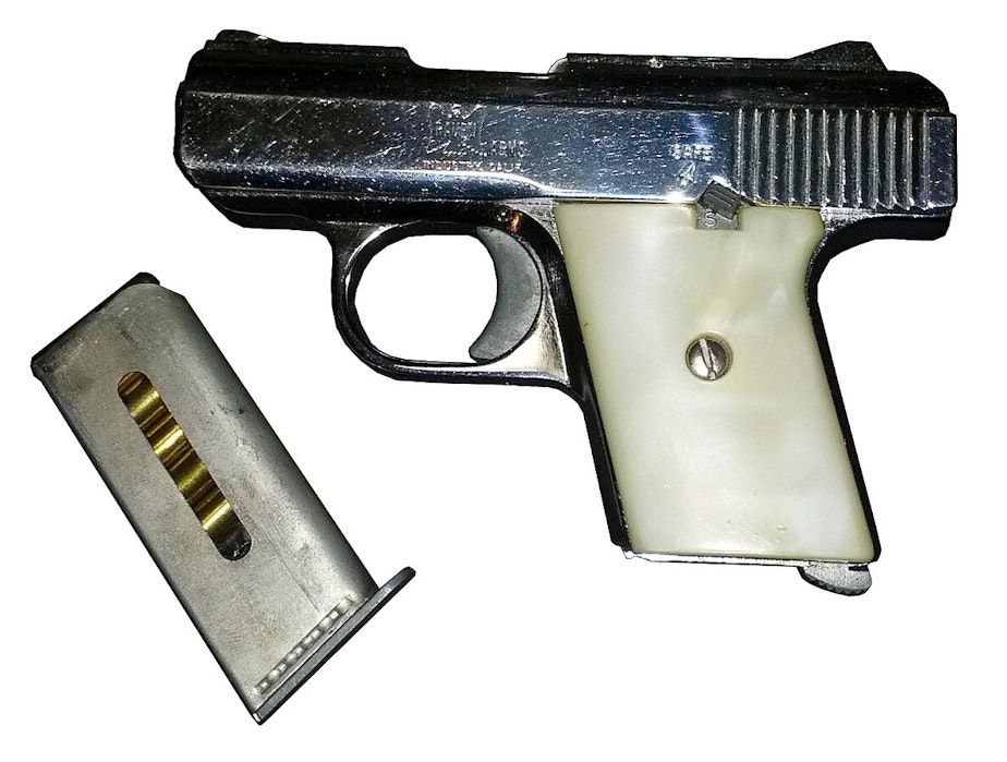 caption: The photo shows an example of a Raven .25 caliber handgun.