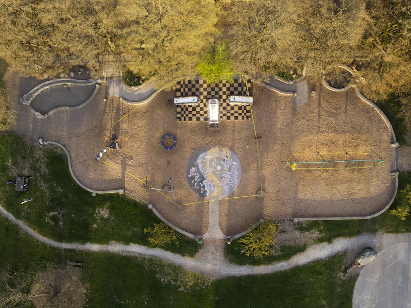 caption: The Meridian Playground is shown roped off with caution tape on Friday, April 10, 2020, in Seattle. Fifteen of Seattle's city parks were closed over the weekend in an effort to slow the spread of the coronavirus outbreak