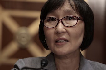 caption: Saule Omarova addresses the Senate Banking Committee during her nomination hearing on Nov. 18 to head the Office of the Comptroller of the Currency. Omarova withdrew her nomination on Tuesday after facing opposition from Republicans and some moderate Democrats.