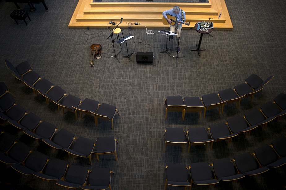 caption: Rabbi Daniel Weiner gets ready to live-stream an empty Shabbat service at Temple de Hirsch Sinai on Friday, March 13, 2020, in Bellevue.
