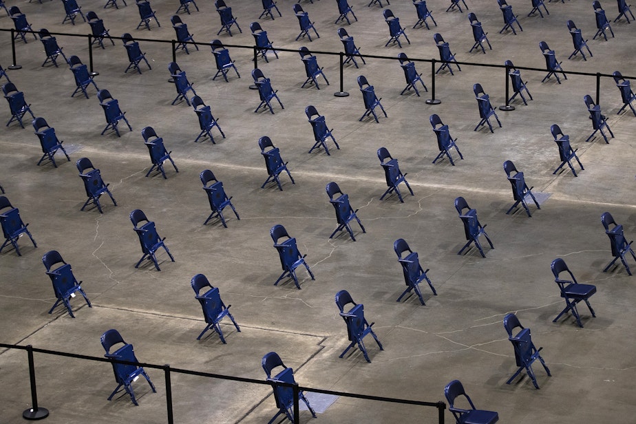 caption: The observation area of a mass Covid-19 vaccination site is shown on Wednesday, March 10, 2021, inside the Lumen Field Events Center in Seattle. The site will be the largest civilian-led vaccination site in the country.