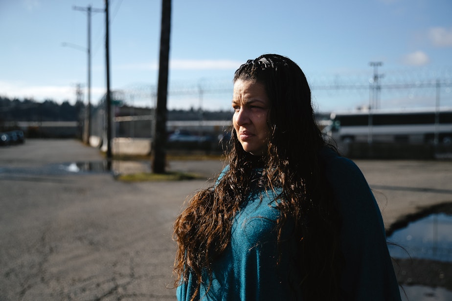 caption: Mary Loisate is portrayed outside of the Northwest ICE Processing Center, where her husband is currently detained, on Monday, March 17, 2025, in Tacoma.