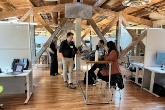 caption: AI House, on the top floor of Pier 70, is built among the trusses that hold up the roof.