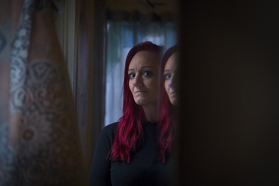 caption: Robin Curtis in her room at a downtown Seattle shelter on Friday, November 15, 2019. Curtis was attacked by a serial rapist two years ago. She testified against him in court this fall.