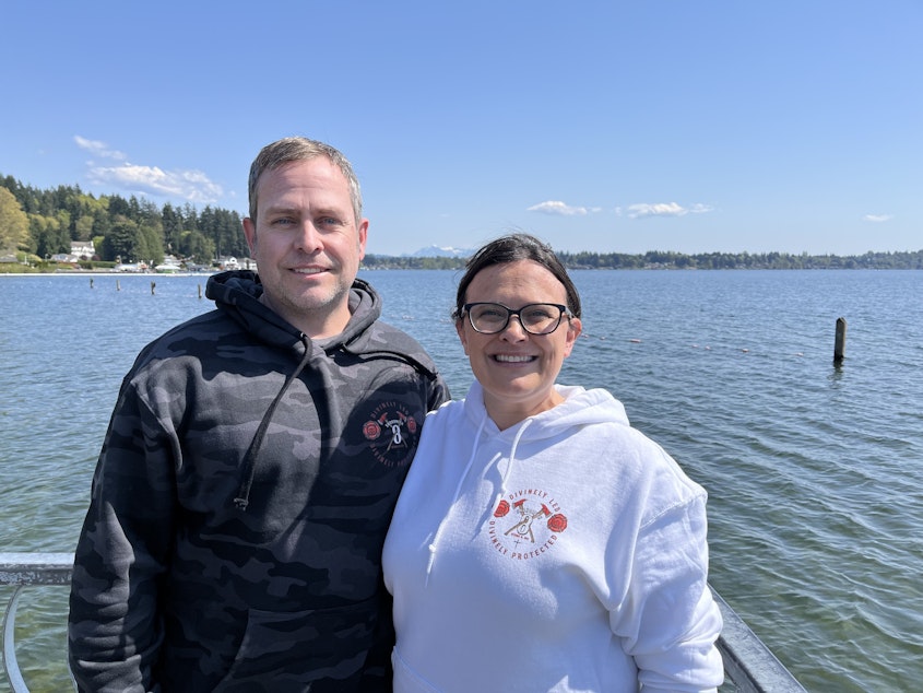 caption: David and Lauren Petersen in Lake Stevens, Washington, in May 2025. David is one of eight plaintiffs suing Snohomish Regional Fire and Rescue for religious discrimination related to the Covid vaccine mandate.