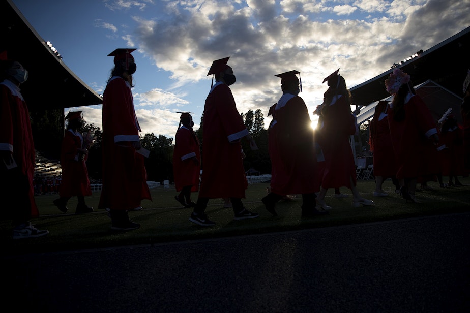 caption: Seattle seniors graduate on Tuesday, June 15, 2021, during an in-person commencement ceremony at Memorial Stadium in Seattle.