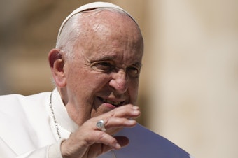 caption: Pope Francis leaves at the end of his weekly general audience in St. Peter's Square, at the Vatican, on Wednesday.