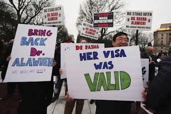 caption: Protesters rally outside the Rhode Island State House in support of deported Brown University Dr. Rasha Alawieh, Monday, March 17, 2025, in Providence, R.I.