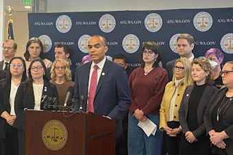 caption: Washington State Attorney General Nick Brown announces a lawsuit challenging President Trump's executive order that targets transgender youth medical practices, Friday, Feb. 7, 2025.