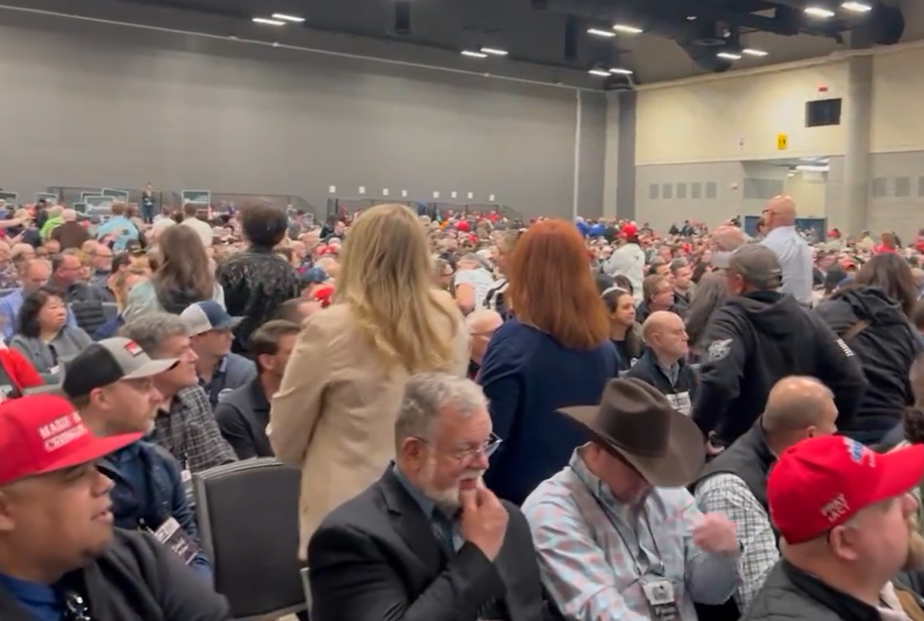 caption: Members of the Washington State Republican Party stood to turn their backs on Jamie Herrera Beutler, a candidate for public lands commissioner, at the party's 2024 convention in Spokane, Wash. As a member of Congress, Herrera Beutler was one of a handful of Republicans who voted to impeach President Trump.