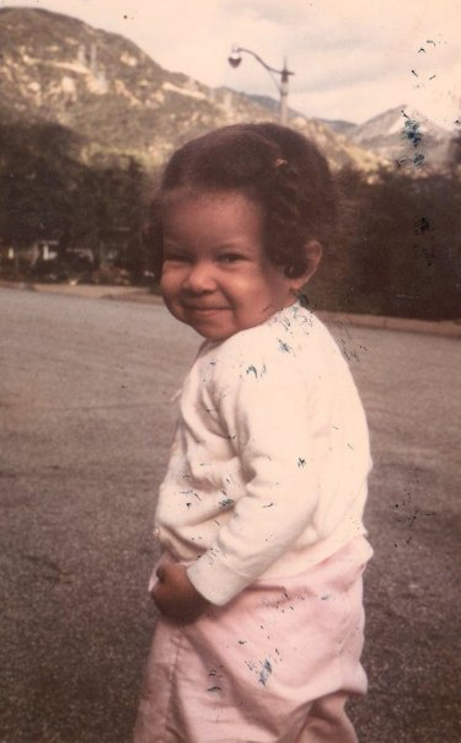 caption: Two-year-old Angela King near childhood home located in the shadow of the San Gabriel Mountains.