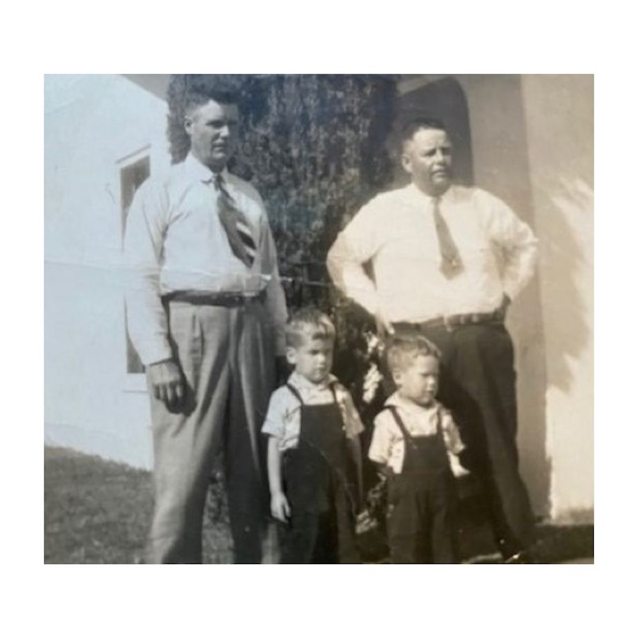 caption: The author's grandfather Rotchley Jones (left) and father Aaron Jones (lower right) around age two, likely photographed in Portland, Oregon in 1947.