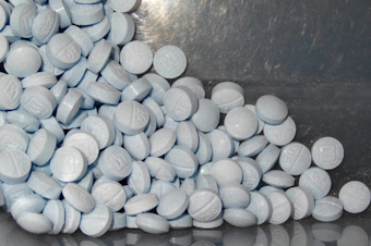 caption: A photo from the U.S. Attorneys Office for Utah shows fentanyl-laced fake oxycodone pills collected during an investigation. The drugs are generally foreign-made with a very close chemical makeup to the dangerous opioid. 